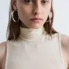 Top senza maniche con collo alto